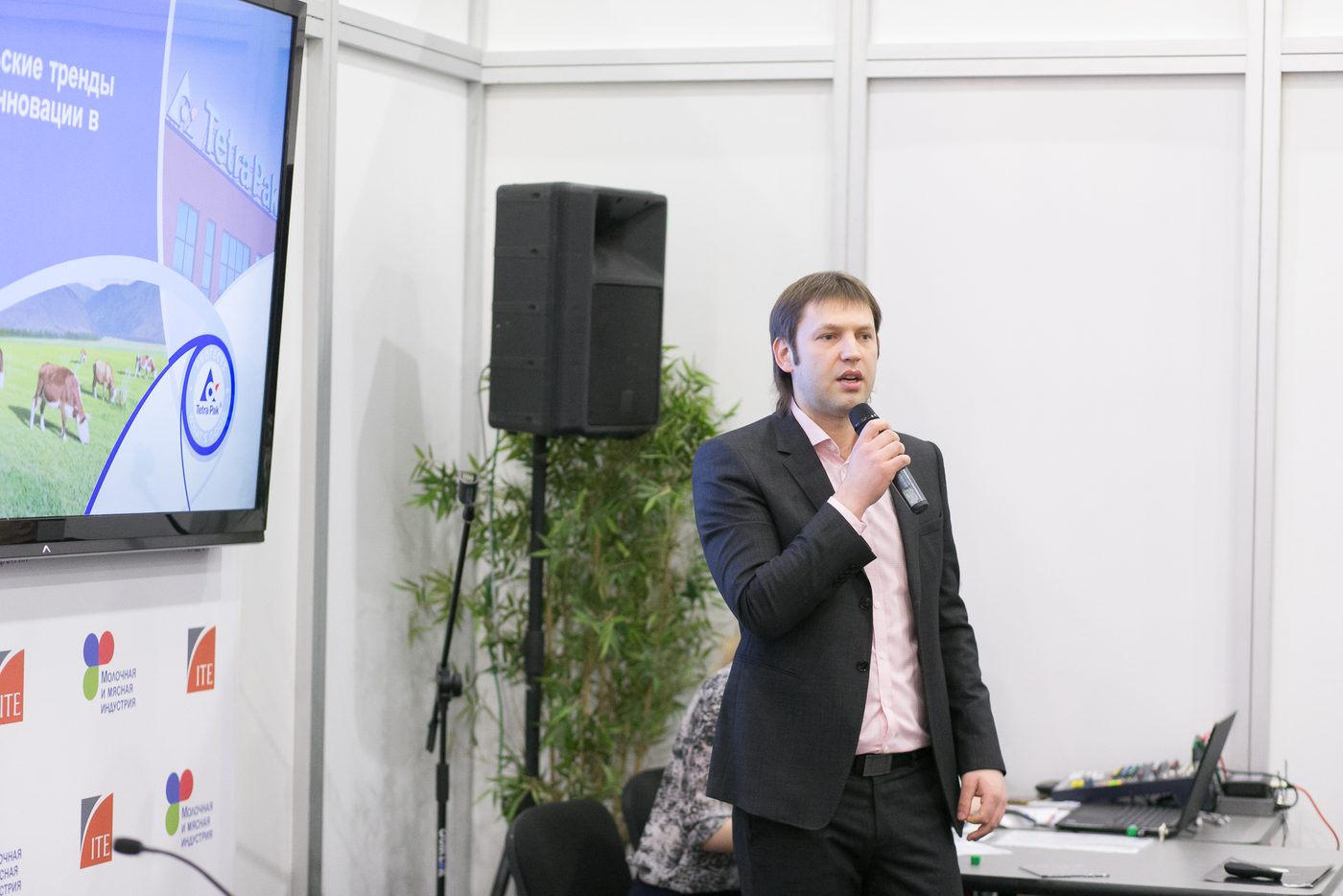 Igor Pomerantsev on stage with a microphone